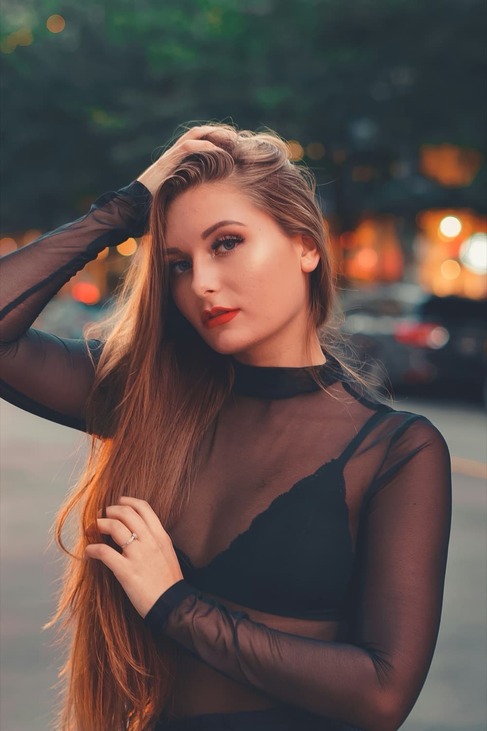 Woman in a black top looking back at the camera