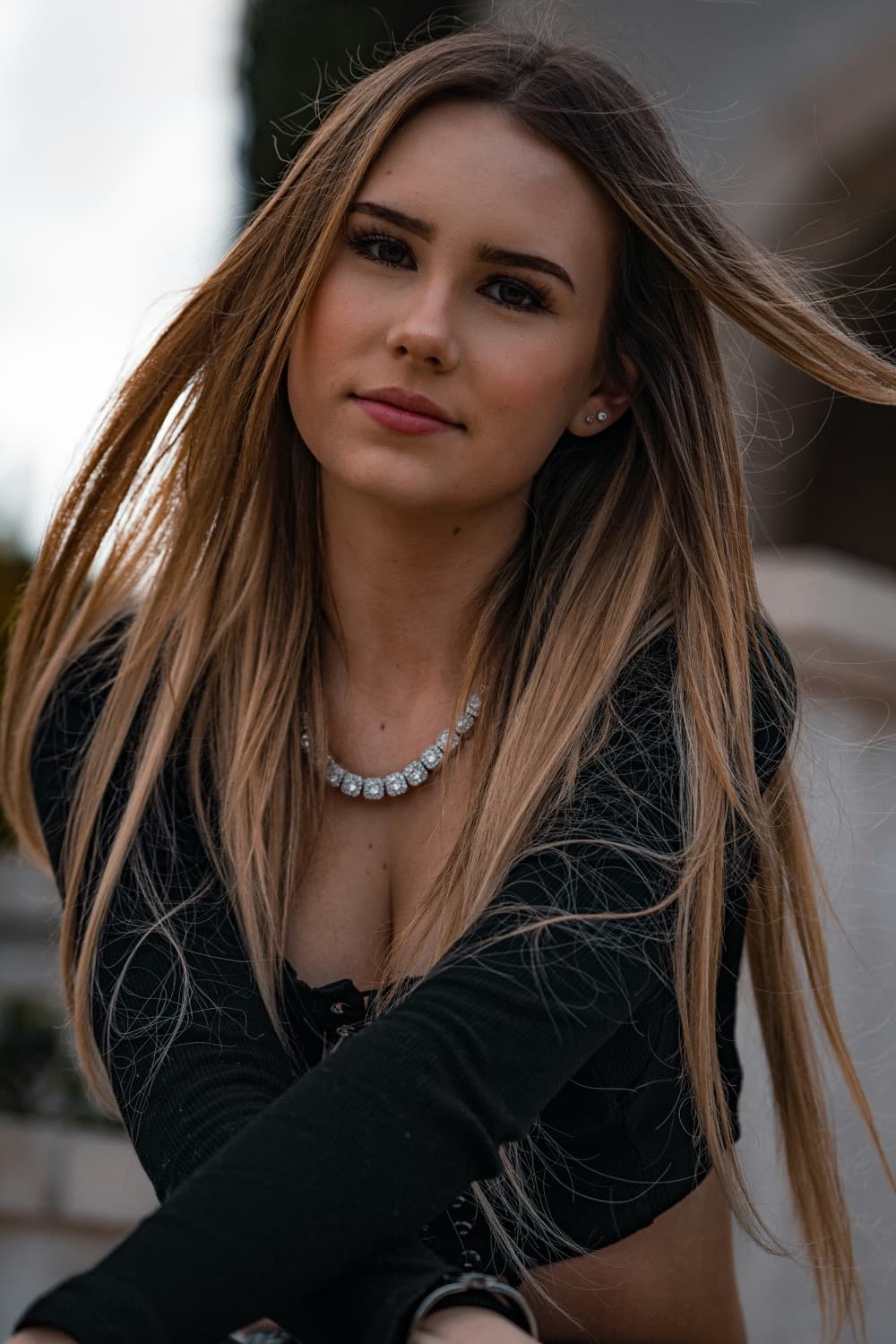 Woman with long hair in a black top