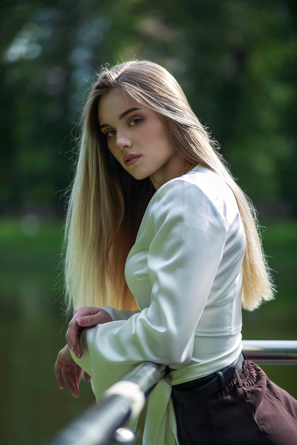 Woman leaning on a railing outdoors